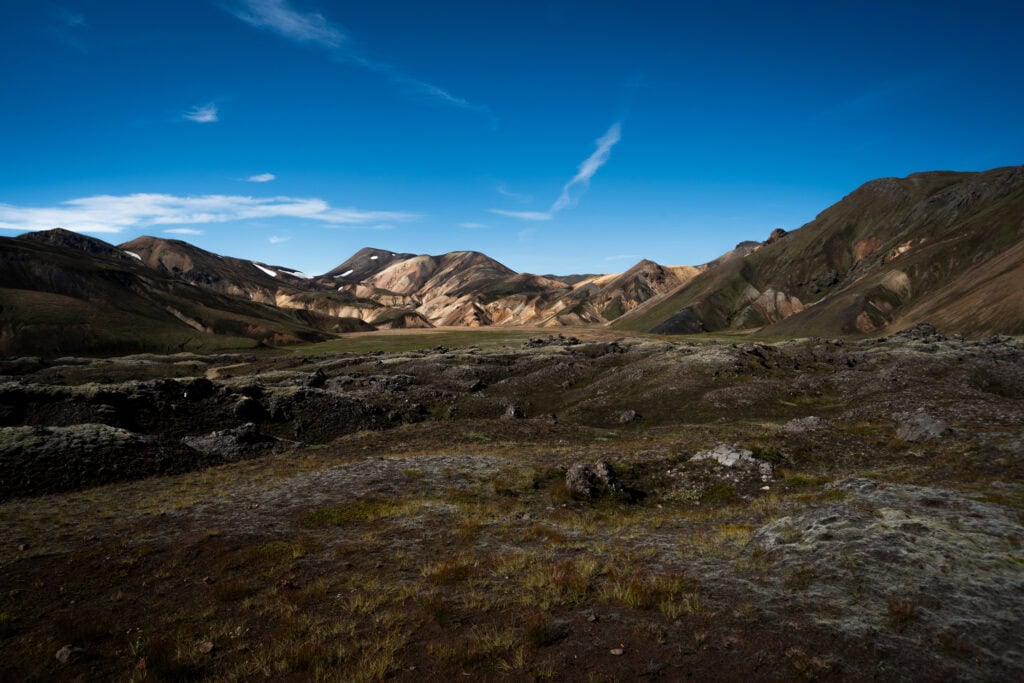 Landmannalaugar highland landscape in Iceland — colourful rhyolite mountains with lava fields and moss-covered ground in the Fjallabak Nature Reserve
