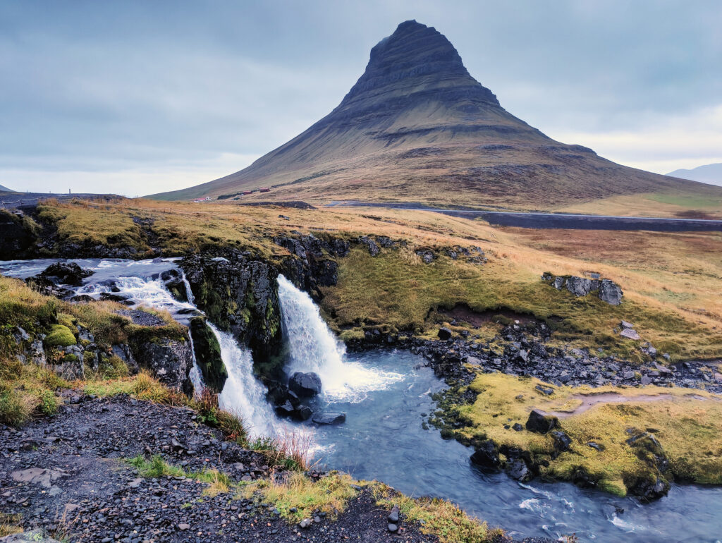 Kirkjufell mountain with Kirkjufellsfoss waterfall in the foreground, Snæfellsnes Peninsula, Iceland — photographed by Marcel Strobel