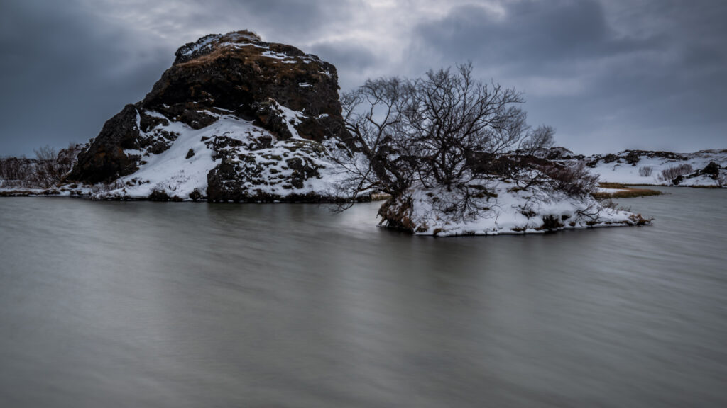 Lava rock island on Lake Mývatn in winter conditions, north Iceland — photographed by Marcel Strobel