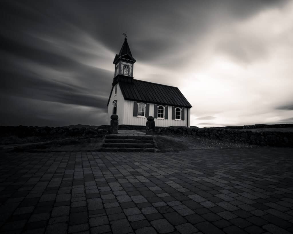 Þingvallakirkja church under a dramatic sky, Þingvellir National Park, Iceland — long exposure photography by Marcel Strobel