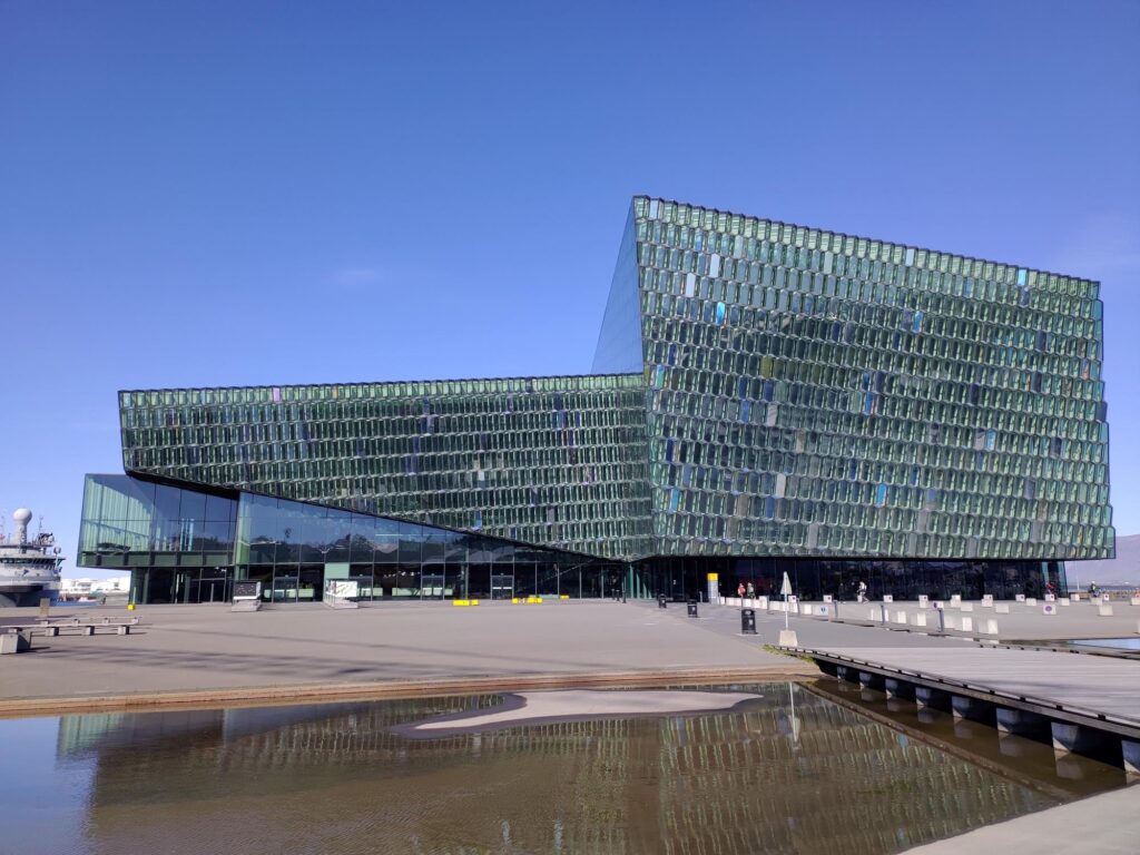 Harpa concert hall with its geometric glass facade at Reykjavík harbour, Iceland — photographed by Marcel Strobel
